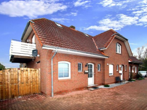 Holiday home in Dornum with garden